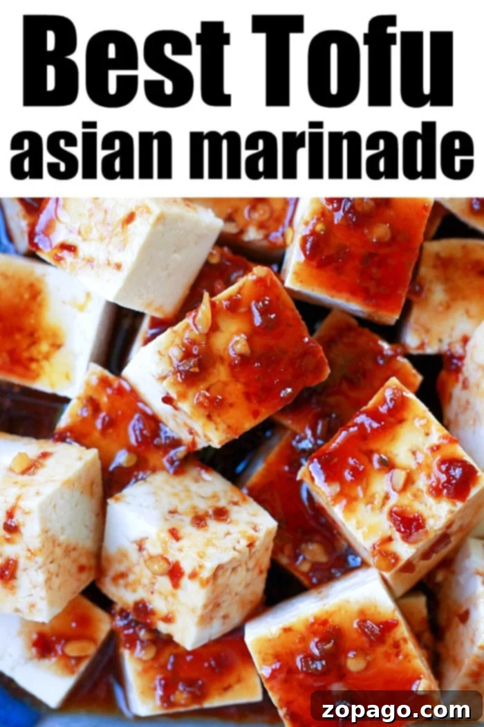 Flavorful Crispy Air Fryer Tofu 7 Close-up of baked tofu marinade, showing the rich coating and tender texture, hinting at the delicious air-fried outcome.