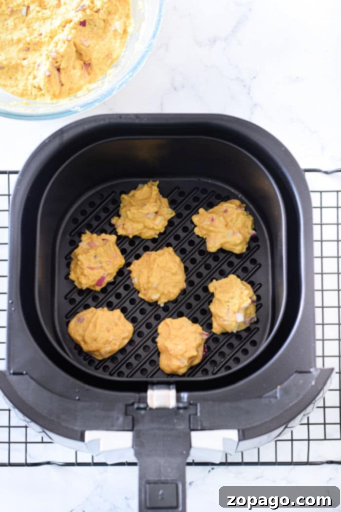 Crispy Air Fryer Hush Puppies 6 Close-up of freshly air-fried hush puppies in a basket