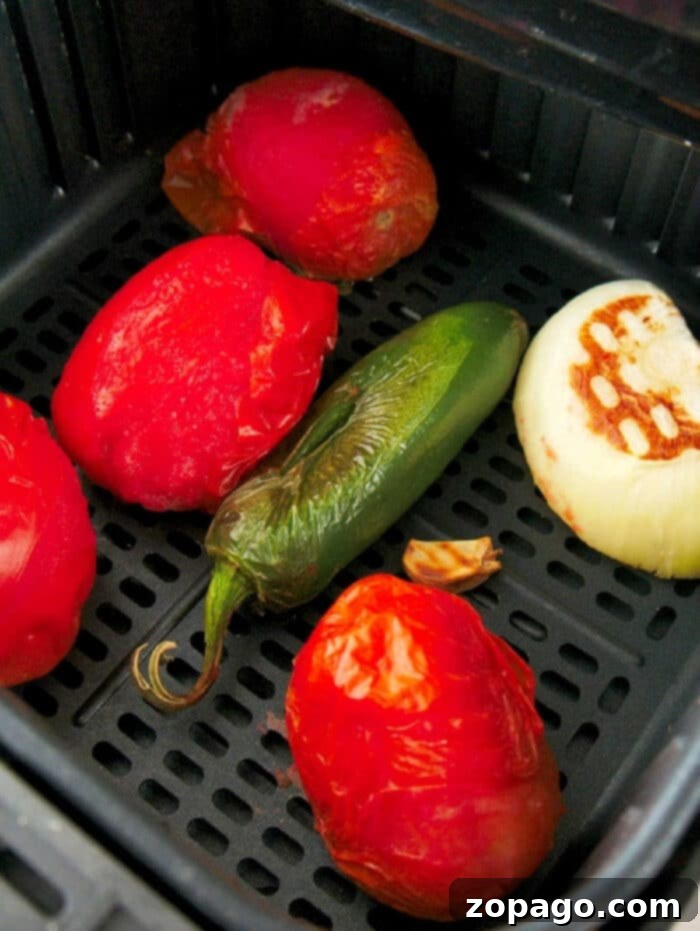 Air Fryer Roasted Tomatoes 2 Beautifully roasted tomatoes ready to be transformed into homemade salsa.