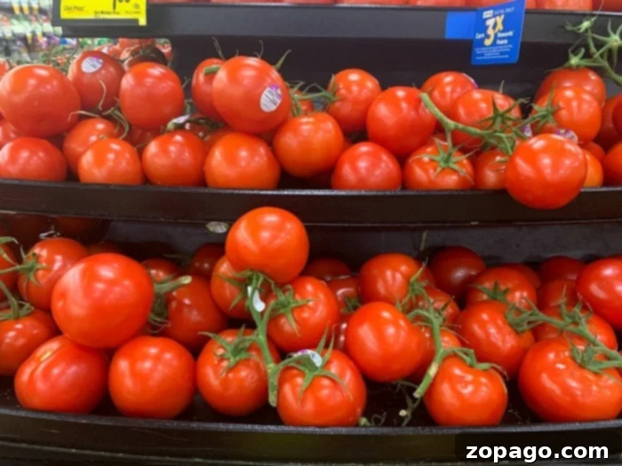 Air Fryer Roasted Tomatoes 7 A basket full of fresh, ripe tomatoes, ready for roasting in the air fryer.