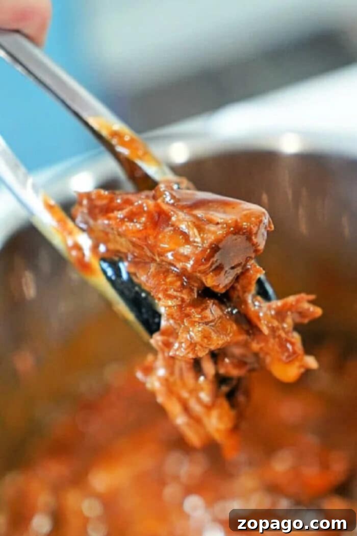 Tender Instant Pot BBQ Beef 2 Instant Pot BBQ Beef, shredded and ready to serve