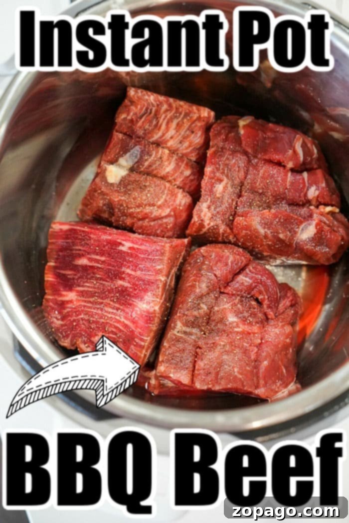 Tender Instant Pot BBQ Beef 5 Shredded barbecue beef in a serving bowl