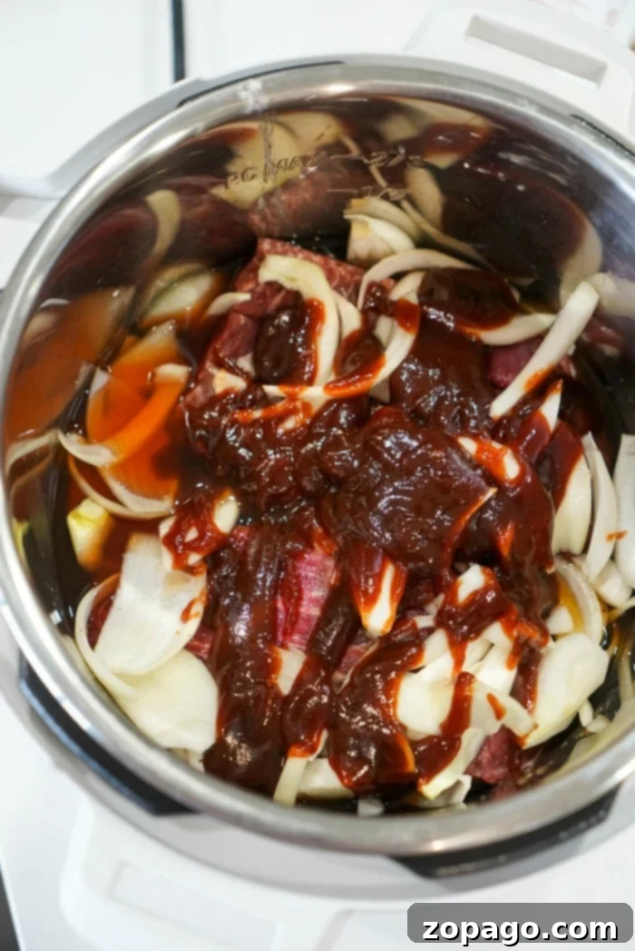 Tender Instant Pot BBQ Beef 9 Instant Pot BBQ beef served on a plate