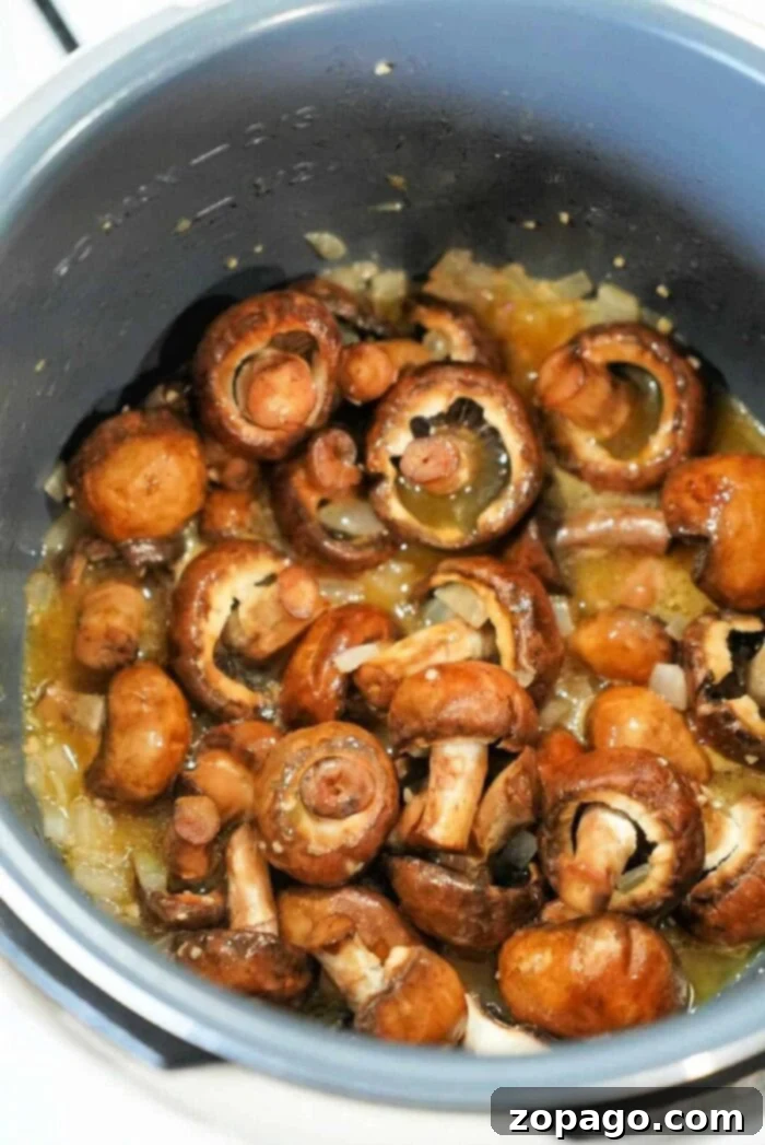 Perfect Instant Pot Mushrooms 8 Close-up of succulent Instant Pot mushrooms and onions.