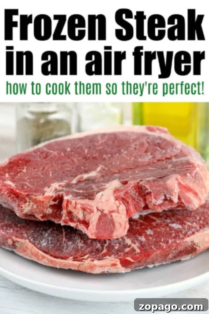 Air Fryer Frozen Steak: Cooked to Perfection 3 Perfectly cooked frozen steak in an air fryer, sliced to show its tender, pink center.