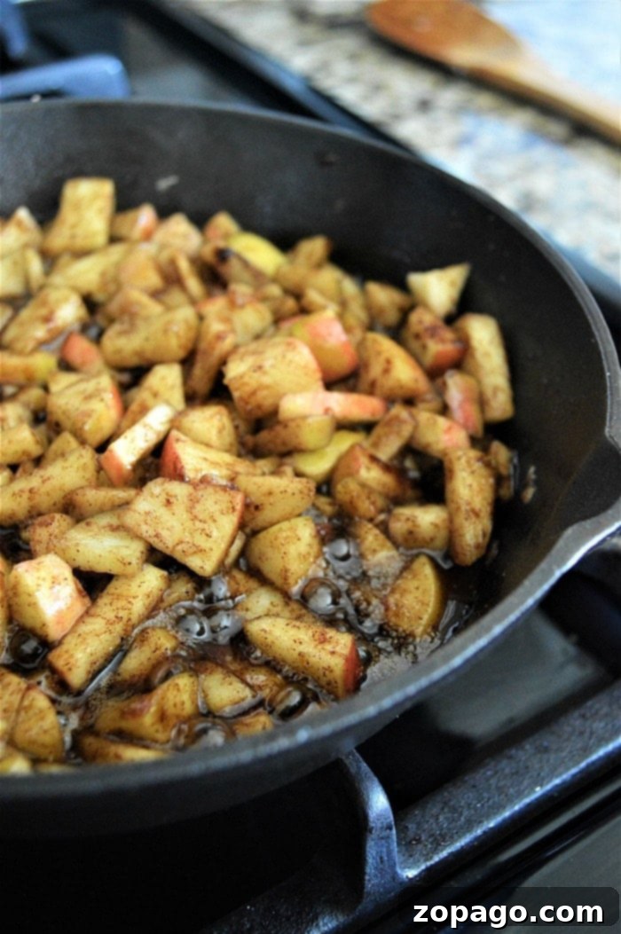 Sweet Cinnamon Pull-Apart Delight 4 Freshly diced Fuji apples tossed with cinnamon and brown sugar, ready for cooking.