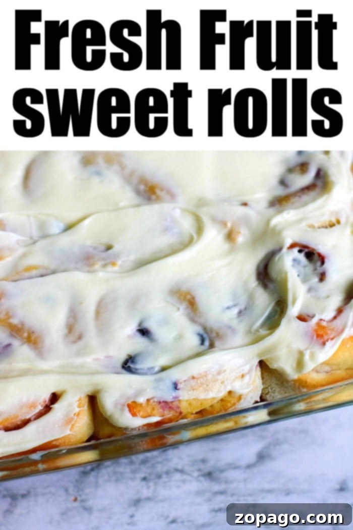 Huckleberry Delights 11 sweet rolls drizzled with glaze and topped with fresh huckleberries, ready to be served
