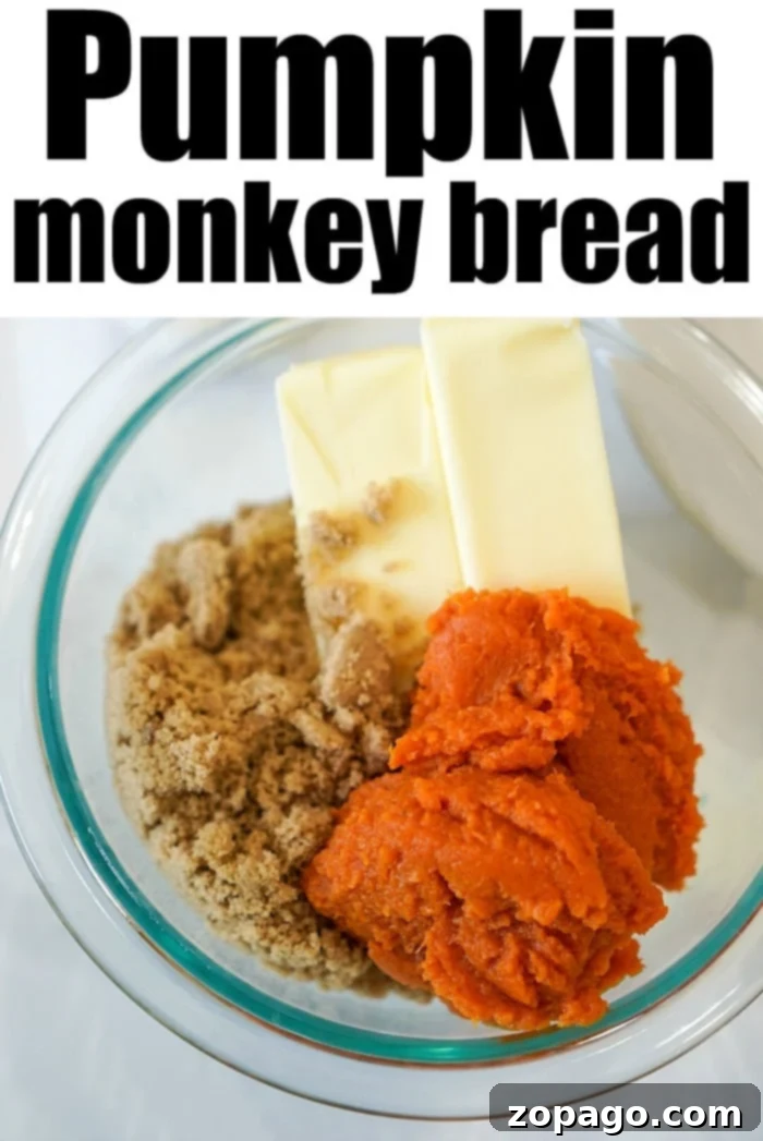 Dangerously Delicious Smoked Monkey Bread 5 Gooey pumpkin monkey bread being served from the pan