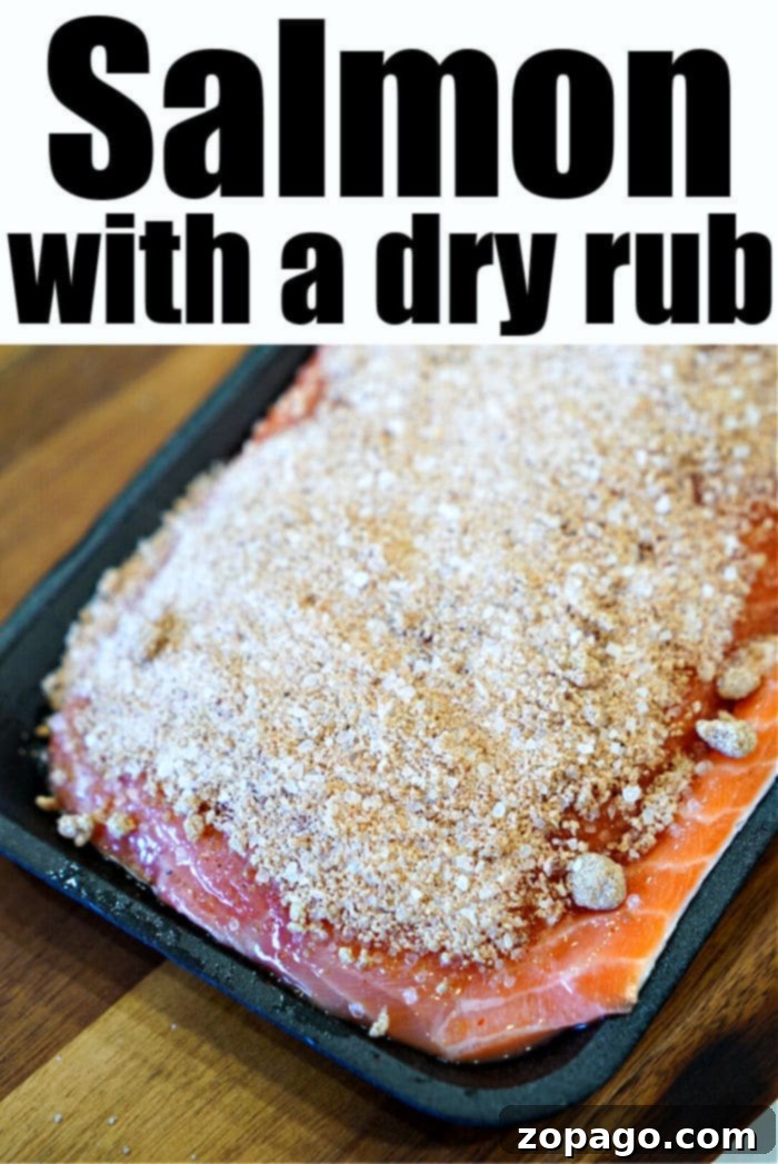 Zesty Herb Salmon Rub 6 A close-up of a generously seasoned salmon fillet, highlighting the vibrant dry rub before cooking, promising rich flavors.