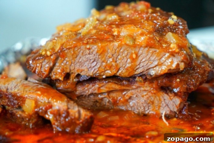Petite Brisket Perfection 9 best brisket - A close-up of beautifully sliced, tender brisket, highlighting the juicy interior and flavorful crust.