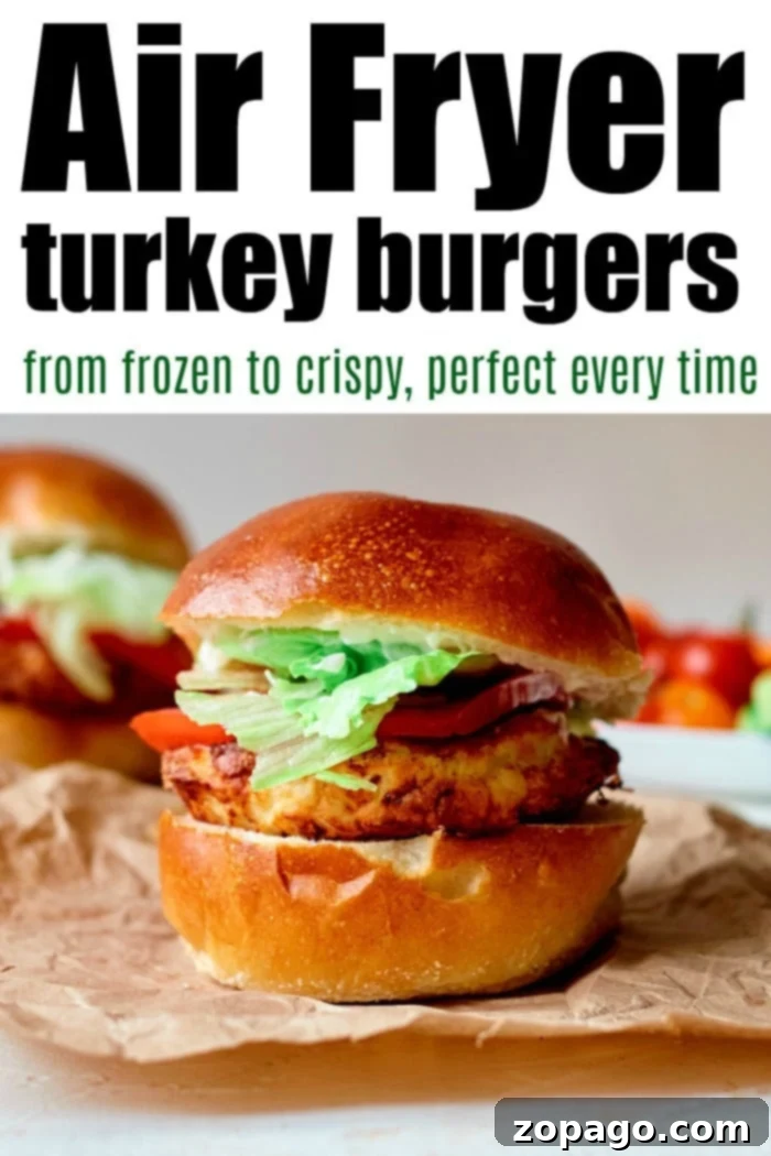 Perfect Air Fryer Frozen Turkey Burgers 7 Frozen turkey burger in air fryer with lettuce and tomato on a bun, accompanied by text and another burger in the background.