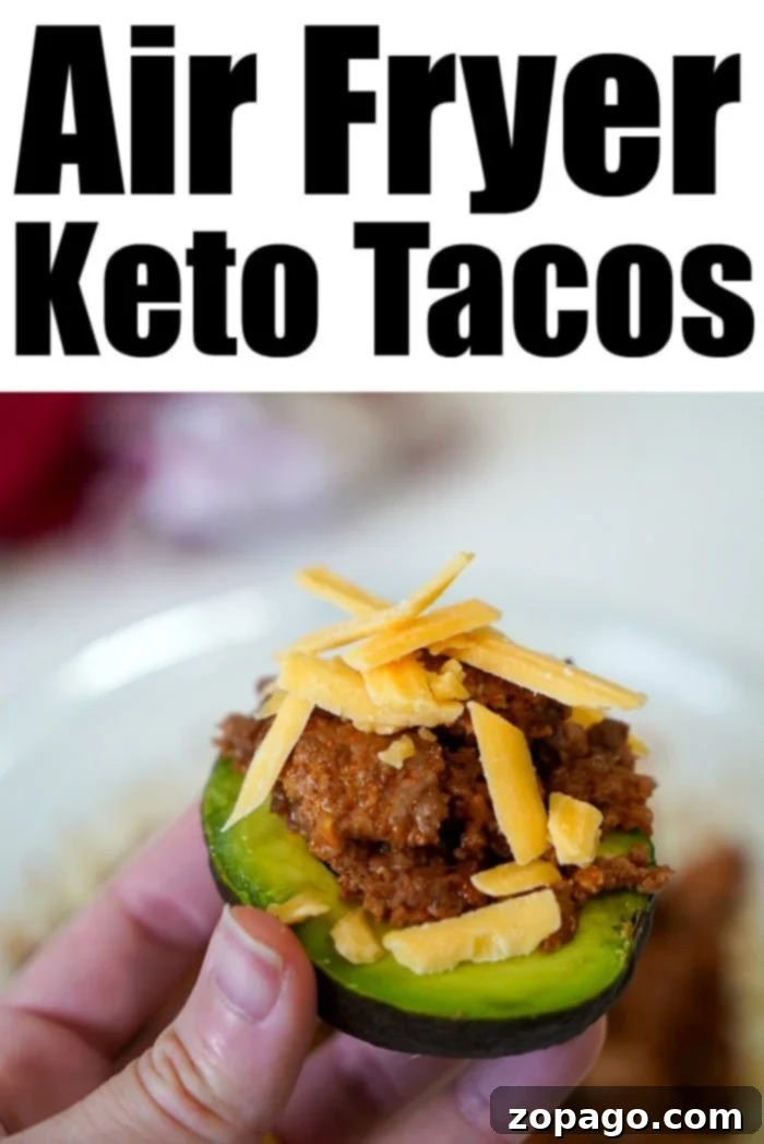 Perfect Air Fryer Ground Beef 5 Delicious air-fried ground beef prepared for a healthy taco served in a zucchini shell, topped with shredded cheese.