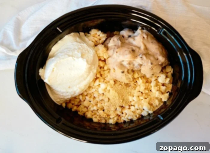 Crockpot Homestyle Cheesy Potato Bake 4 Crockpot funeral potatoes with frozen potatoes, sour cream, mushroom soup, and grated cheese sit on a white cloth background, showcasing the raw ingredients.