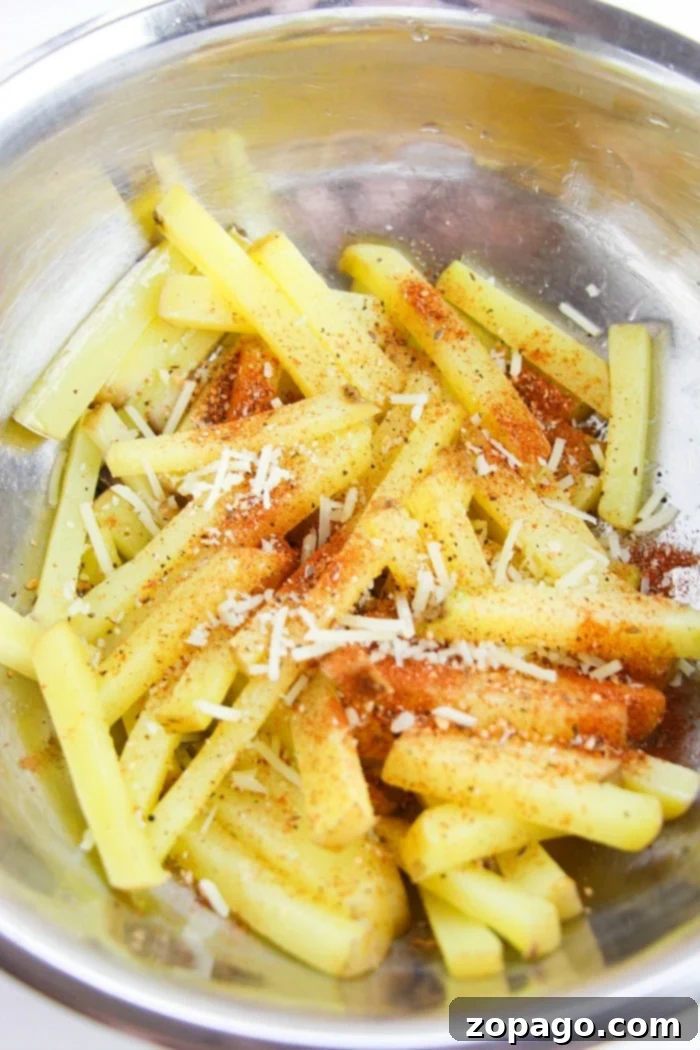 Perfect Bake Time for Fries at 400F 5 Perfectly golden and crispy homemade oven fries on a baking sheet.