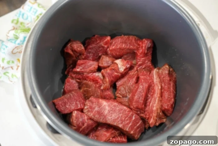 Instant Pot Mississippi Roast 4 A large piece of beef ready for the Instant Pot, surrounded by ingredients