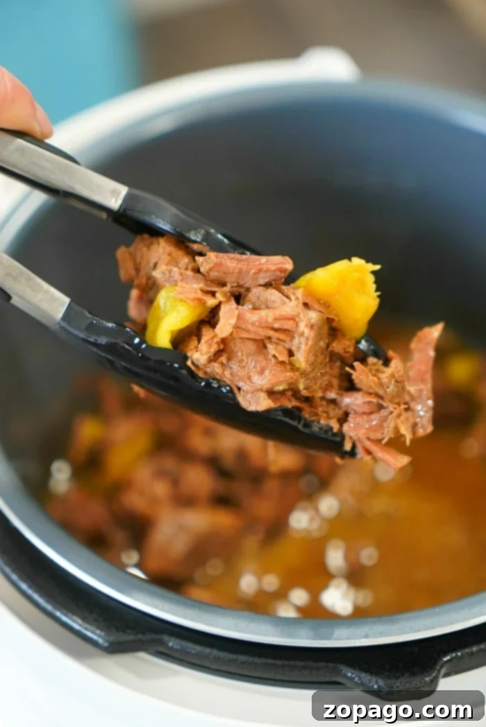 Instant Pot Mississippi Roast 8 A large serving platter piled high with tender shredded Mississippi roast