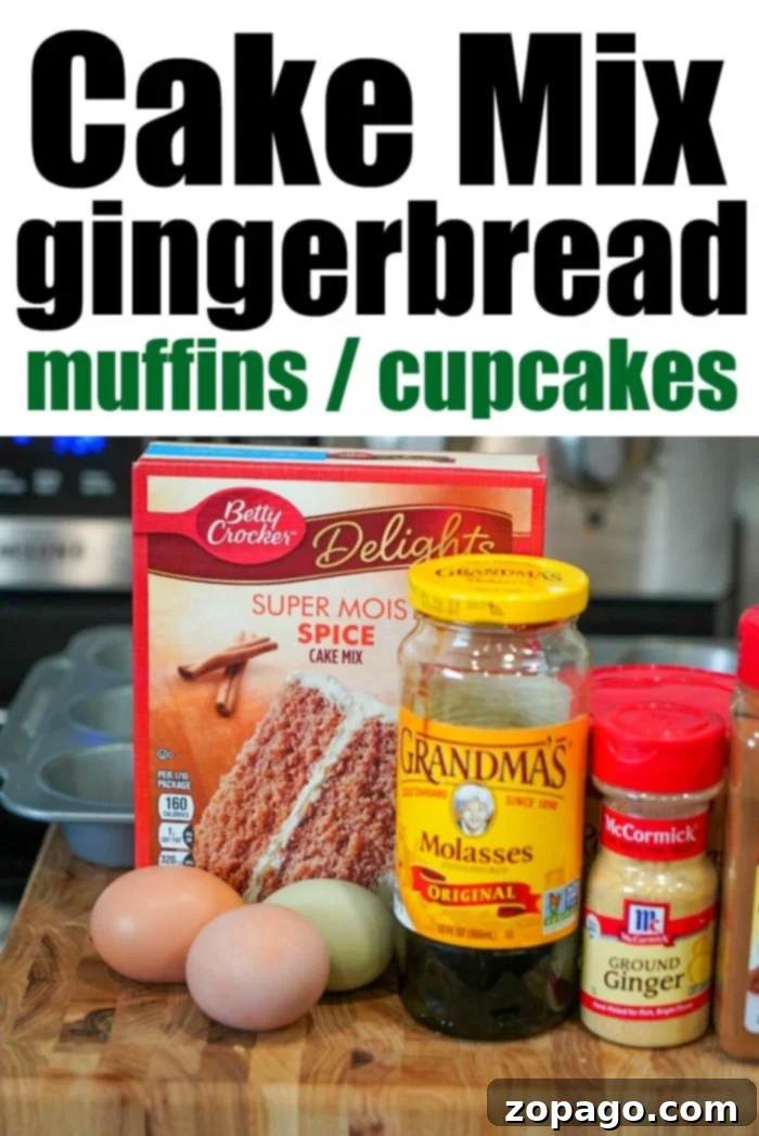 Gingerbread Cake Mix Muffins 3 Two soft and fluffy gingerbread muffins, lightly dusted with powdered sugar, resting on a rustic wooden cutting board with holiday decorations in the background.