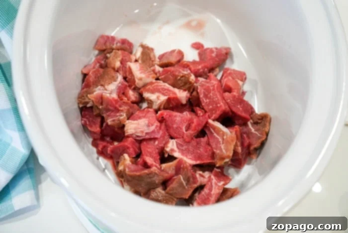 Fall-Apart Tender Slow Cooker Pork Carnitas 5 cubed pork ready for the crockpot, prepared for an easy and delicious slow cooker pork carnitas recipe.