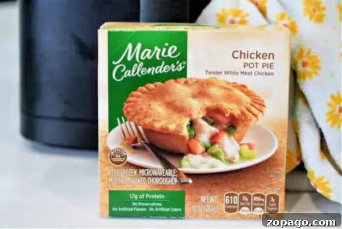 Crispy Air Fryer Frozen Pot Pie 4 A Marie Callender's Chicken Pot Pie box is shown in the image, perfect for a quick meal in an air fryer. The packaging highlights tender white meat chicken, 17g of protein, and no preservatives or artificial flavors, while offering a clear view of the product's nutritional information.