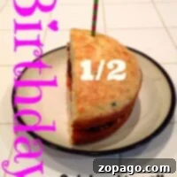 Whip Up a Half Birthday Treat 6 Half birthday cake with a candle, text Birthday 1/2 Celebrations on a tiled surface.