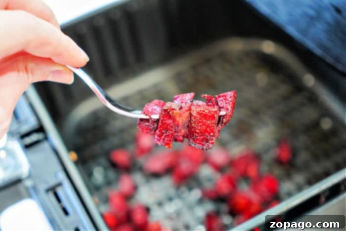 Crispy Air Fryer Beets 2 A basket full of diced beets ready to be cooked in an air fryer, promising a delicious and healthy side dish.