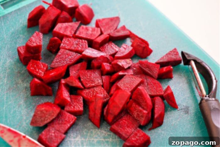Crispy Air Fryer Beets 5 A close-up of vibrant, peeled beets chopped into even pieces, ready for seasoning and air frying.