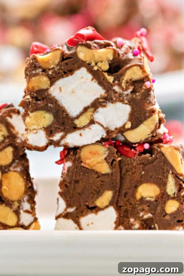 Fudgy No-Bake Marshmallow Bars 2 Irresistible No-Bake Chocolate Marshmallow Squares, also known as Rocky Road Bars, bursting with peanuts and sweet condensed milk.