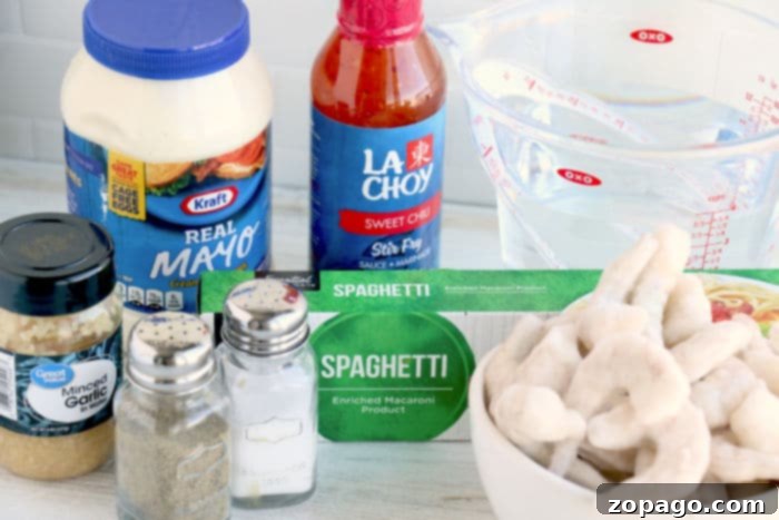 Irresistible Instant Pot Bang Bang Shrimp 4 Creamy bang bang shrimp in a bowl, ready to be mixed with pasta