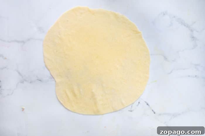 Crafting Your Own Egg Roll Wrappers 4 Soft, smooth egg roll dough ball resting on a surface