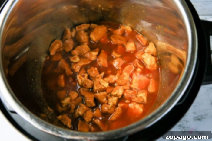 Flavorful Asian Chicken 7 Cooked Asian Chicken with a thick, glossy sauce, ready to serve.