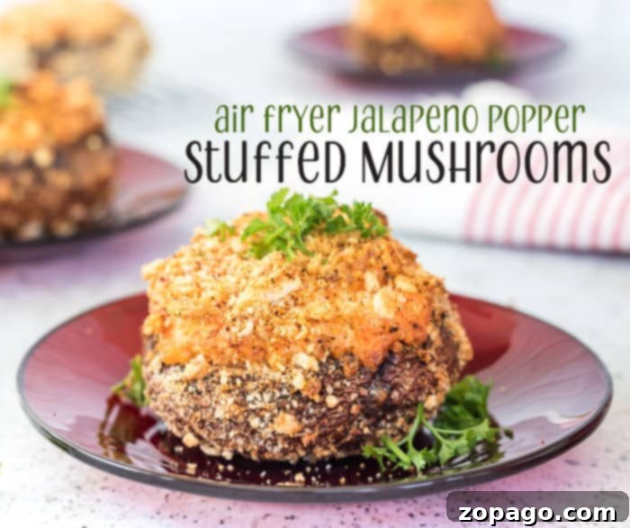 Effortless Air Fryer Stuffed Mushrooms 9 Spicy stuffed mushrooms with visible jalapeno pieces, ready to be served.