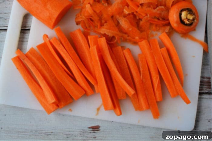 Sweet and Crispy Air Fryer Carrot Sticks 3 Freshly cut carrot sticks ready for air frying