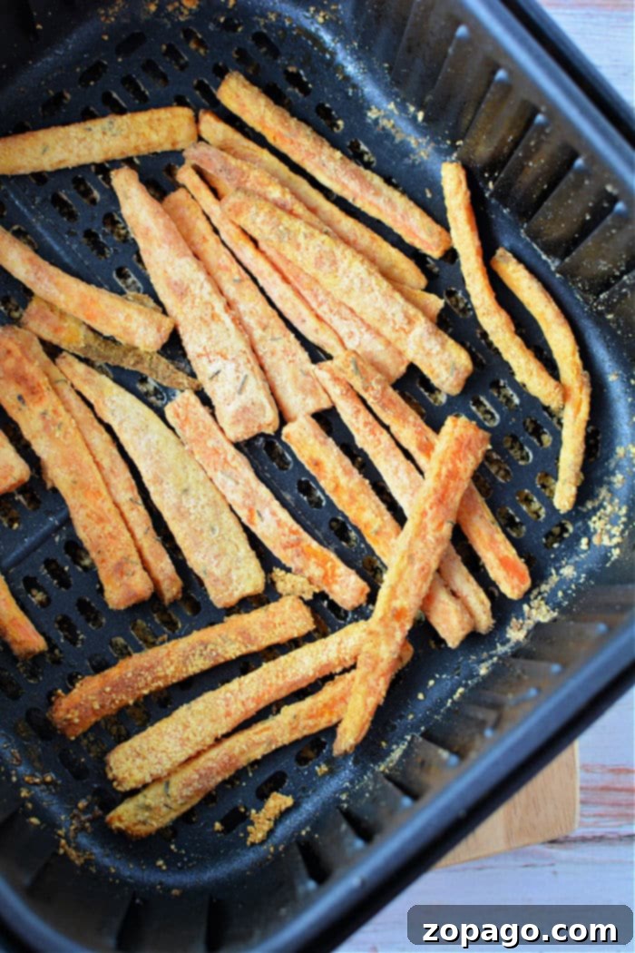 Sweet and Crispy Air Fryer Carrot Sticks 7 Plate of perfectly air fried carrots, golden brown and crispy