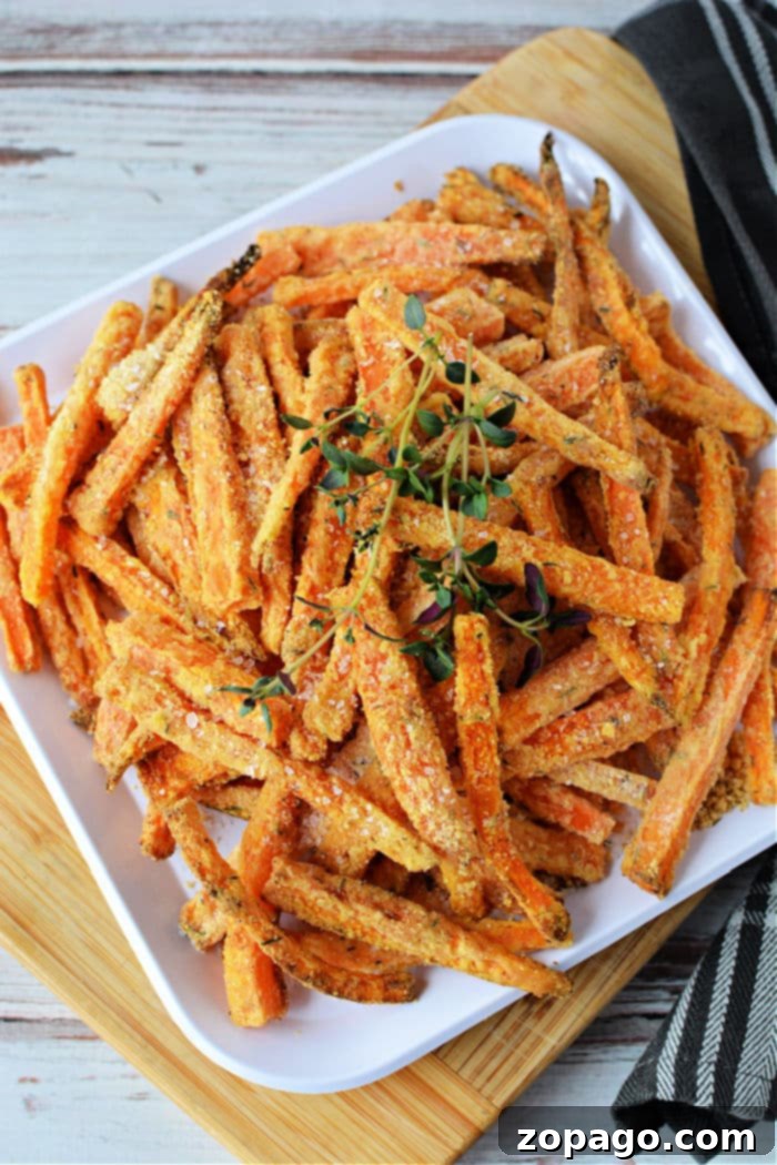 Sweet and Crispy Air Fryer Carrot Sticks 8 Close-up of crispy air fryer carrot fries on a rustic wooden board