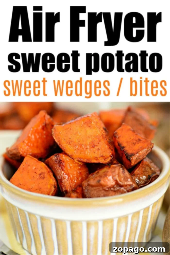 Crispy Air Fryer Sweet Potatoes 10 A vibrant bowl of freshly cooked Air Fryer Sweet Potato Cubes, perfectly golden and tender, garnished with a sprinkle of fresh herbs.