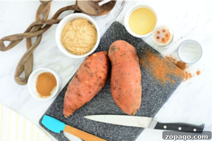 Crispy Air Fryer Sweet Potatoes 4 Fresh, raw sweet potatoes, ready for preparation.
