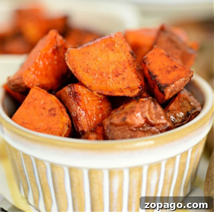Crispy Air Fryer Sweet Potatoes 8 A close-up shot of golden, perfectly air-fried sweet potato wedges, indicating a delicious, crispy texture.