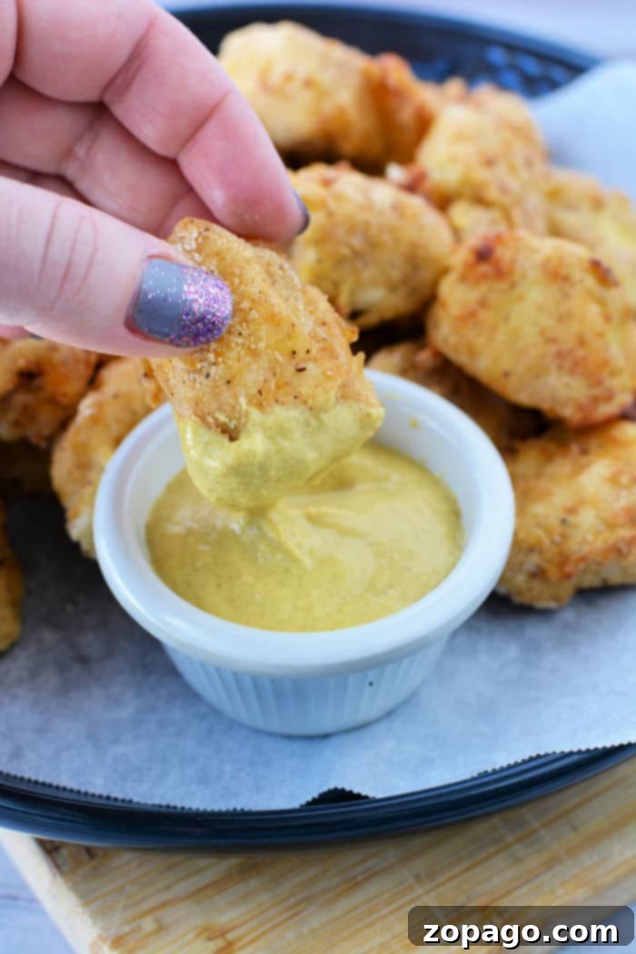 Homemade Crispy Air Fryer Chicken Nuggets 2 Crispy Chick-fil-A style air fryer chicken nuggets ready to be served.