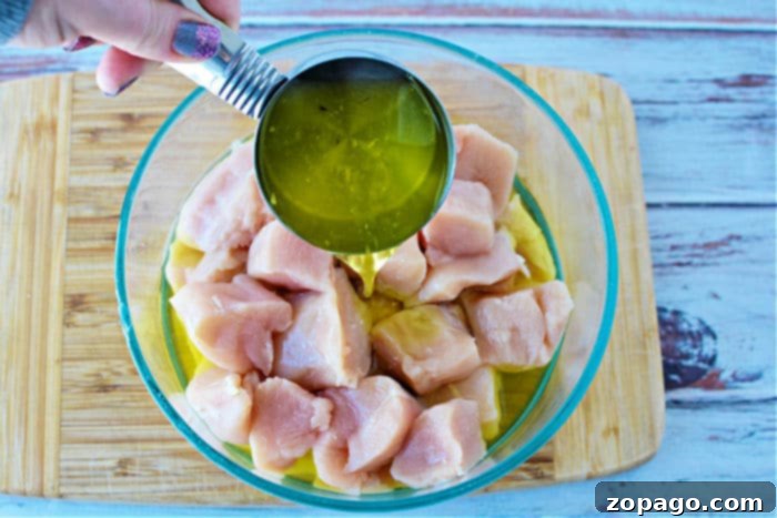 Homemade Crispy Air Fryer Chicken Nuggets 3 Fresh boneless, skinless chicken breasts cubed and ready for marinating.