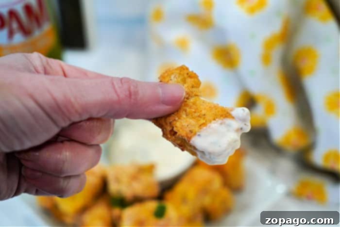 Homemade air fryer fish sticks on a plate.