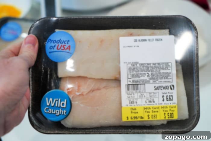 Close-up of freshly cut fish fillets, ready for breading.