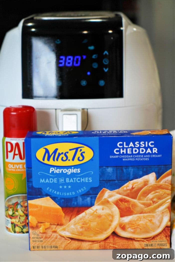 Crispy Air Fryer Pierogies From Frozen 4 Batch of pierogies cooking in an air fryer basket