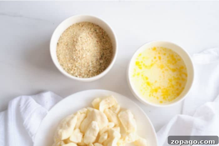 Perfectly Crispy Air Fryer Cheese Curds 4 Close-up of breadcrumbs in a bowl, ready for coating cheese curds.