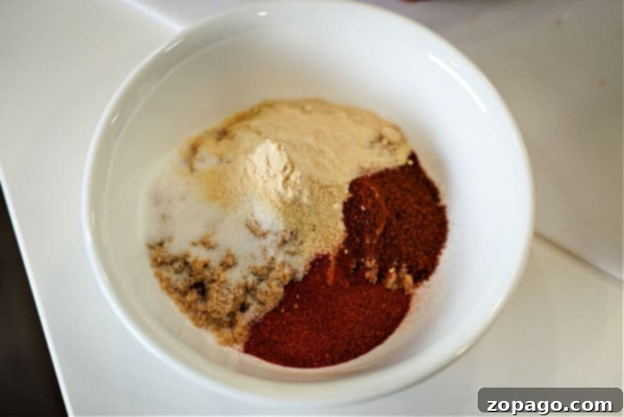 Ultimate Tri-Tip BBQ Blend 5 A tri-tip roast generously coated with a savory dry rub, ready for cooking.