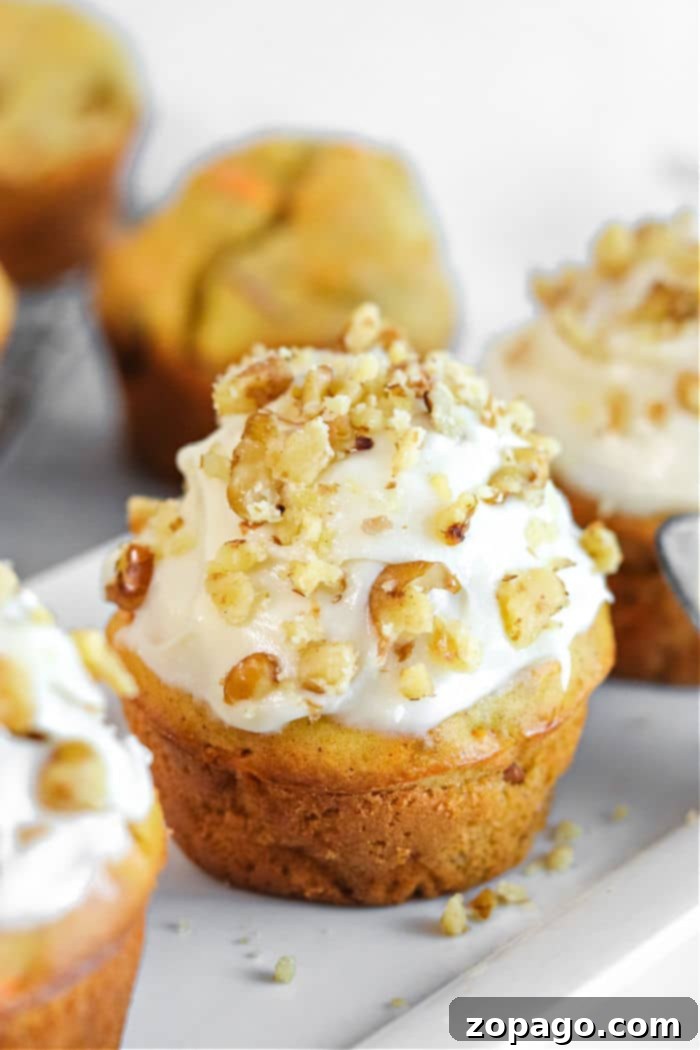 Farmhouse Apple Carrot Muffins 7 An easy and delicious muffin recipe, showcasing beautifully baked apple carrot muffins.