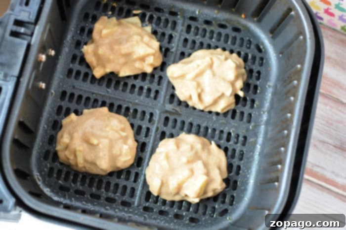Air Fryer Apple Fritter Perfection 6 Perfectly cooked air fryer apple fritters with a golden-brown hue, ready for glazing.