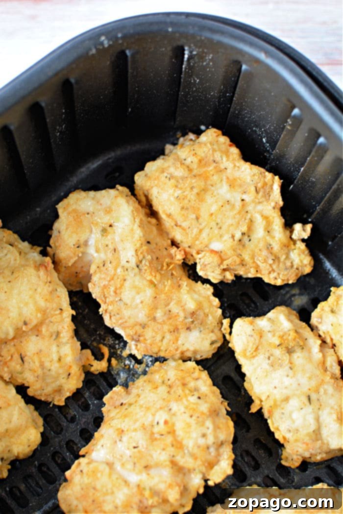 Crispy Air-Fried Chicken Breast 9 Air Fryer Fried Chicken Breast recipe served with fresh herbs