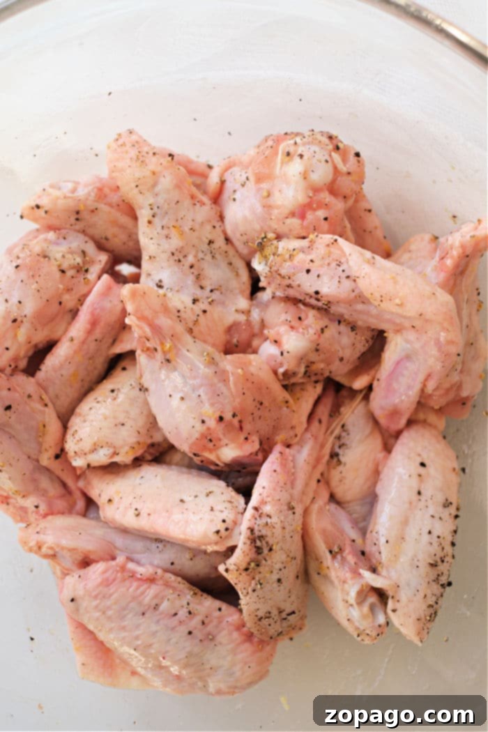 Crispy Air Fryer Lemon Pepper Wings 4 Perfectly seasoned chicken wings ready for air frying