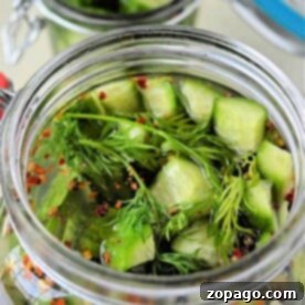Discover how to make pickles at home with this delightful duo: two jars filled with crisp cucumber pickles, fresh dill, and aromatic spices.