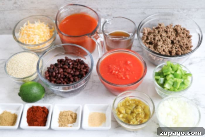 Easy Slow Cooker Enchilada Casserole 3 Overhead shot of a Crockpot enchilada casserole simmering, showcasing the rich, bubbly cheese and vibrant ingredients.